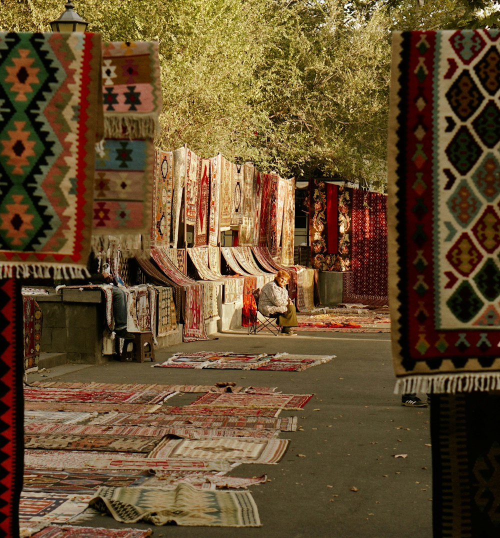 a bunch of rugs that are on the ground