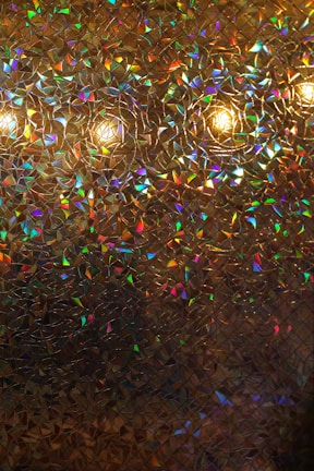 Close-up of a colorful geometric kaleidoscope design featuring reds, oranges, and yellows.