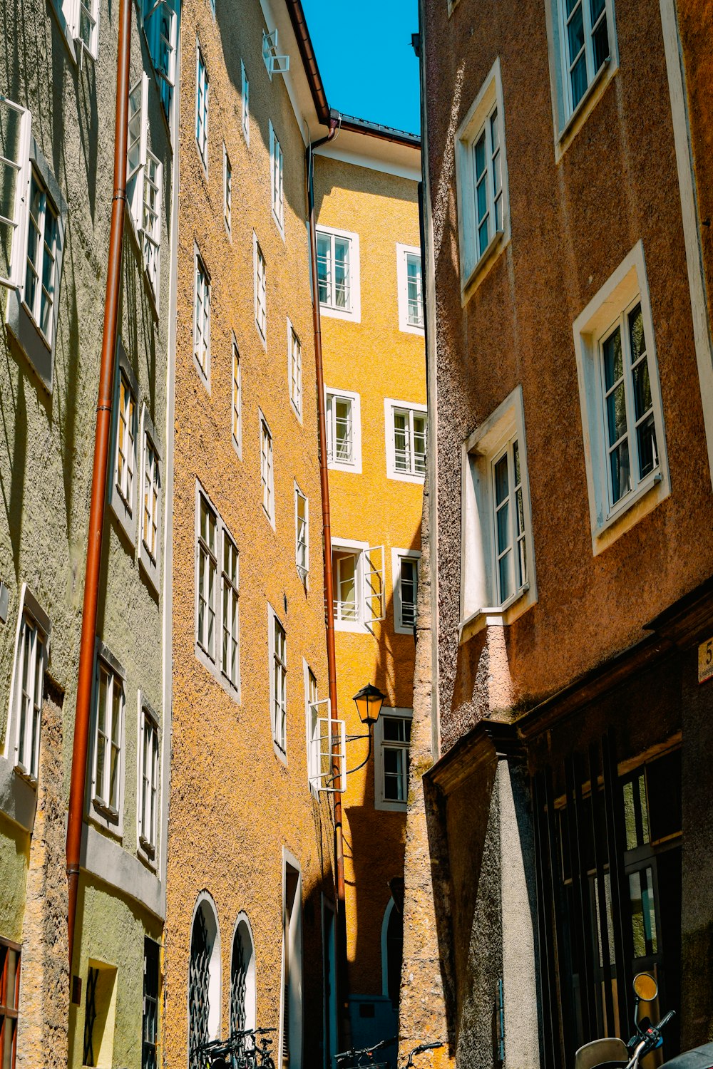 a narrow alleyway with a bicycle parked on the side