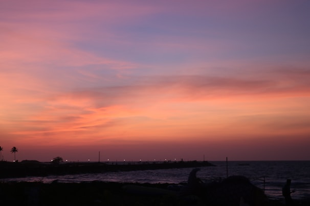 Sunset view over Puerto Vallarta's coastline with vibrant orange and pink skies.