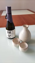 A close-up of a traditional sake bottle and cups.