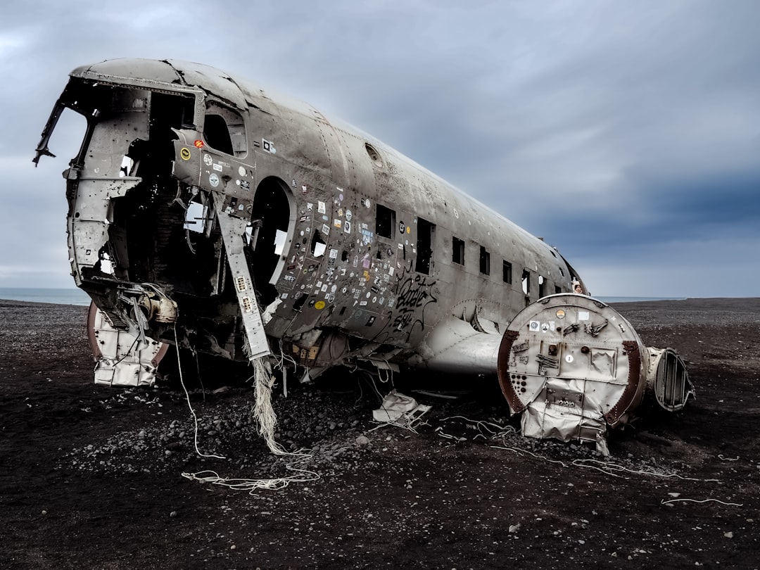 a plane that is sitting in the dirt, The famous Solheim plane wreck.