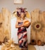 a woman in a colorful dress holding a plate