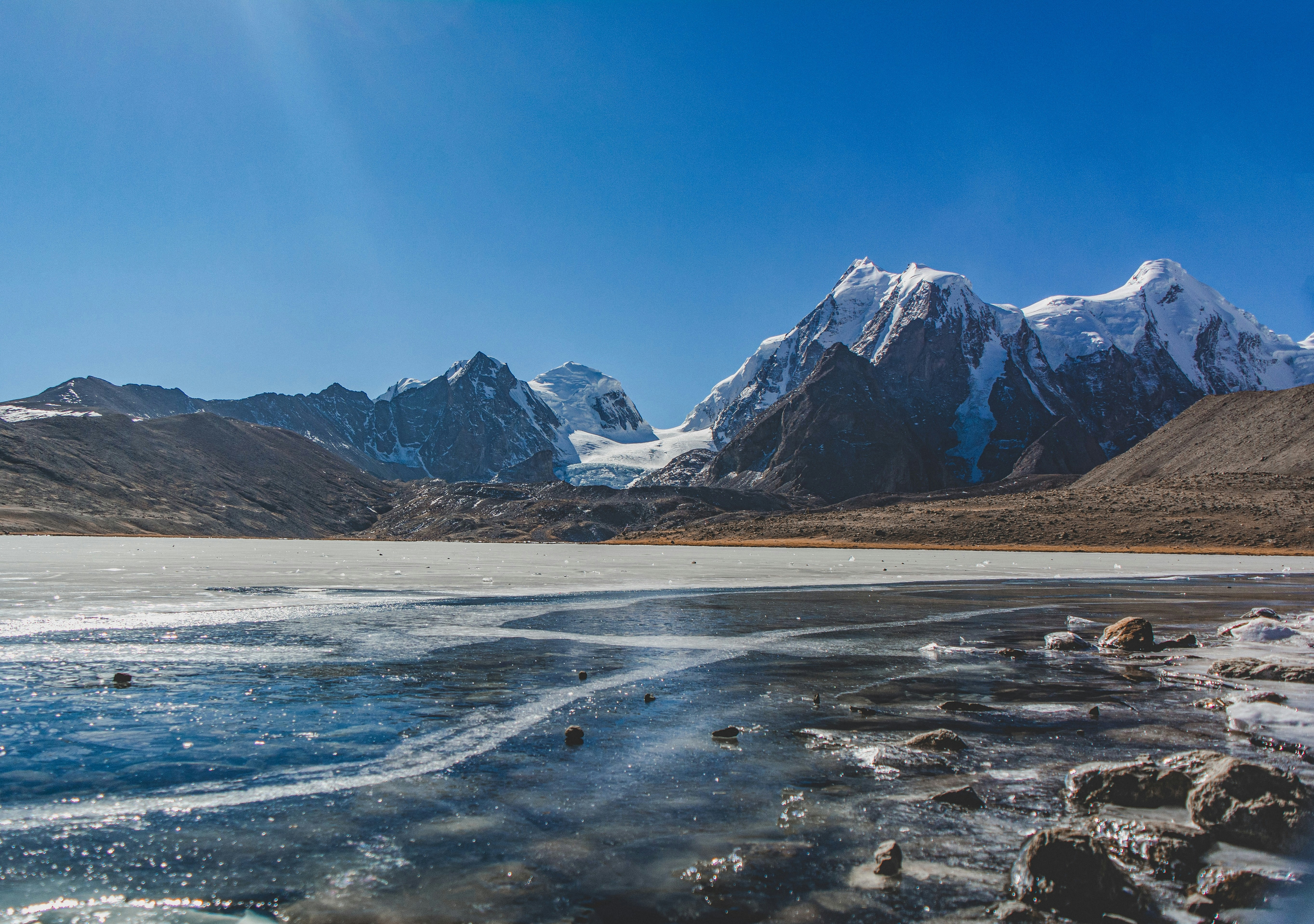the mountains are covered in snow and ice