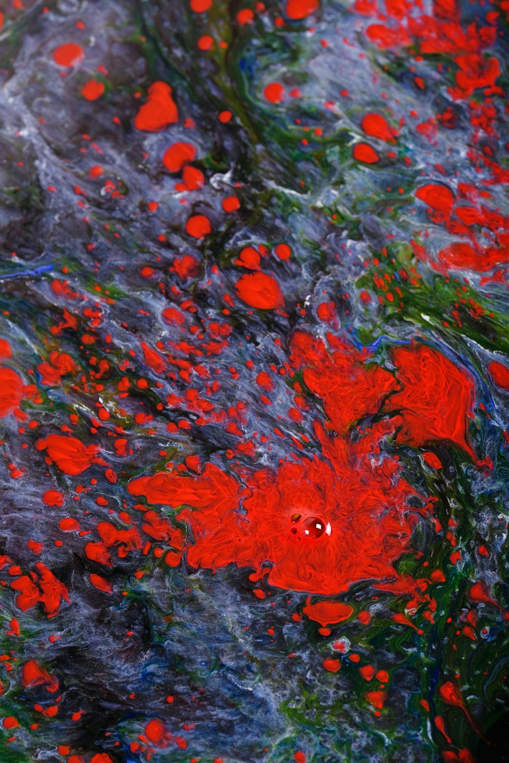 a painting of red flowers and green leaves