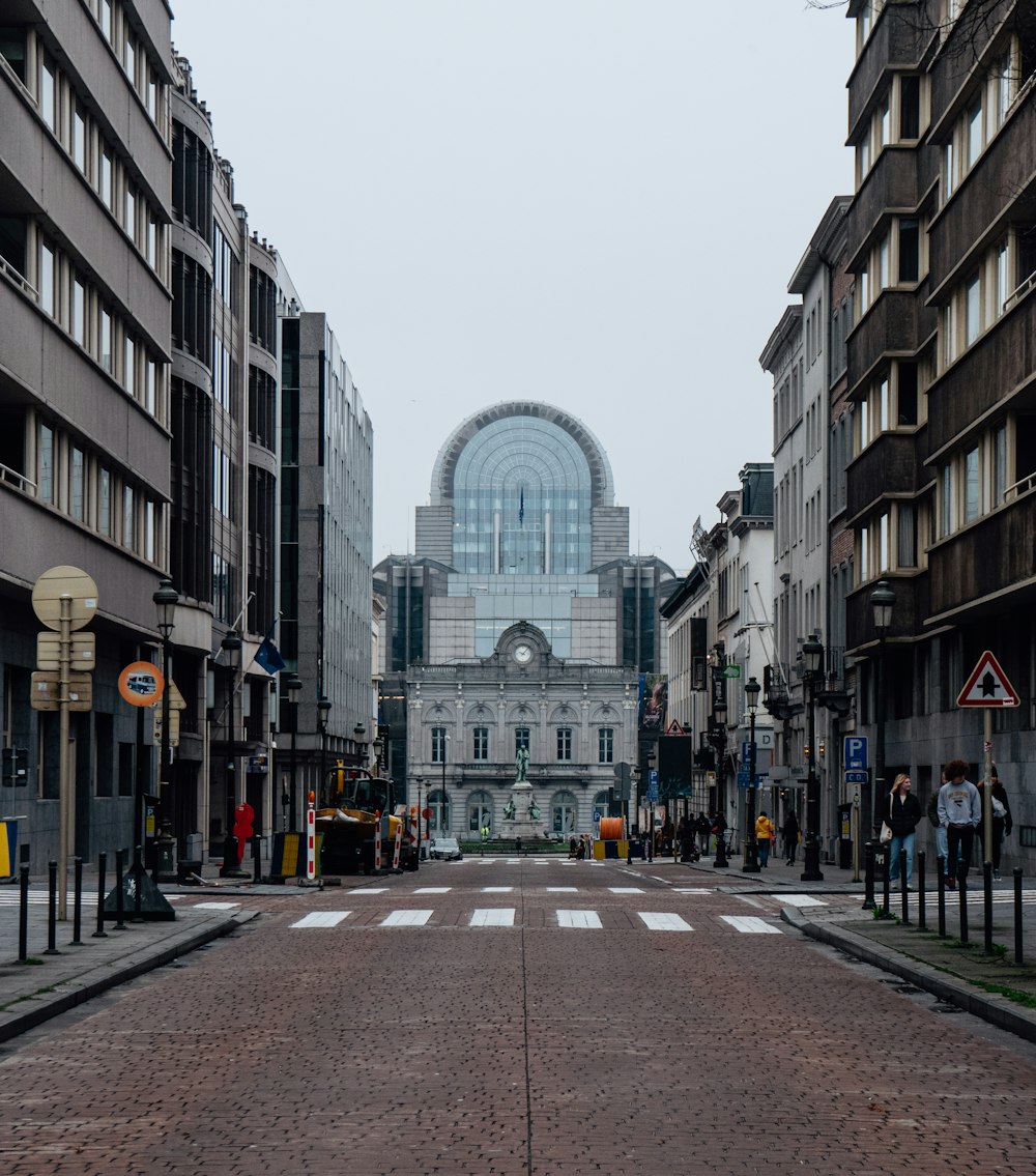 a city street lined with tall buildings