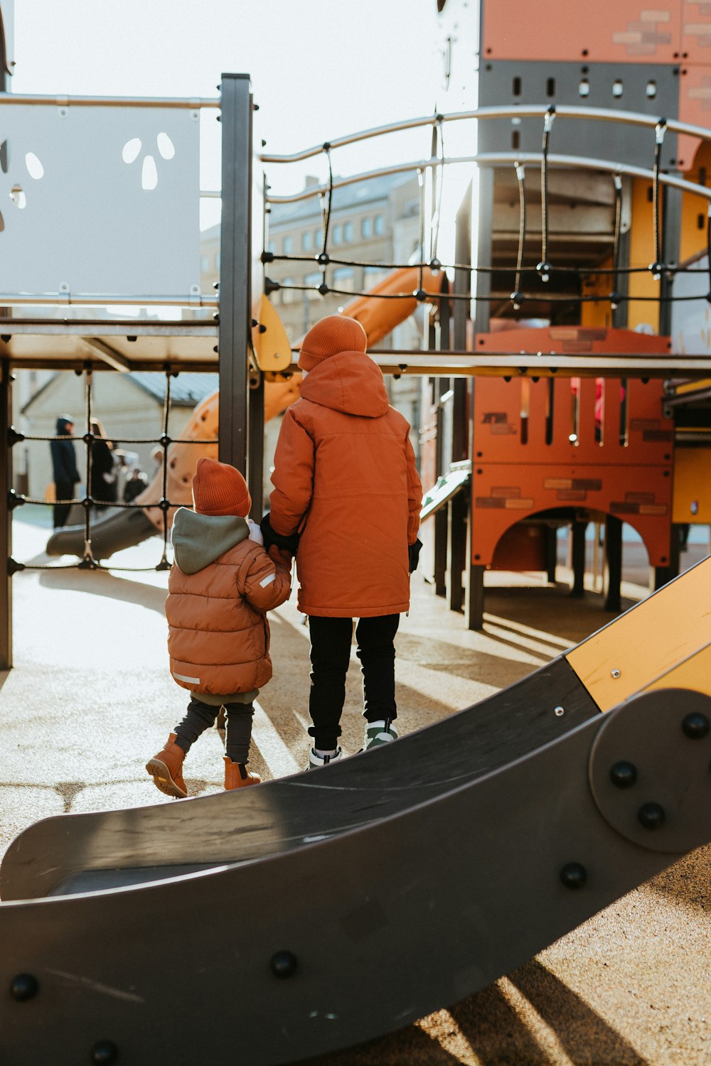 a couple of kids standing next to each other