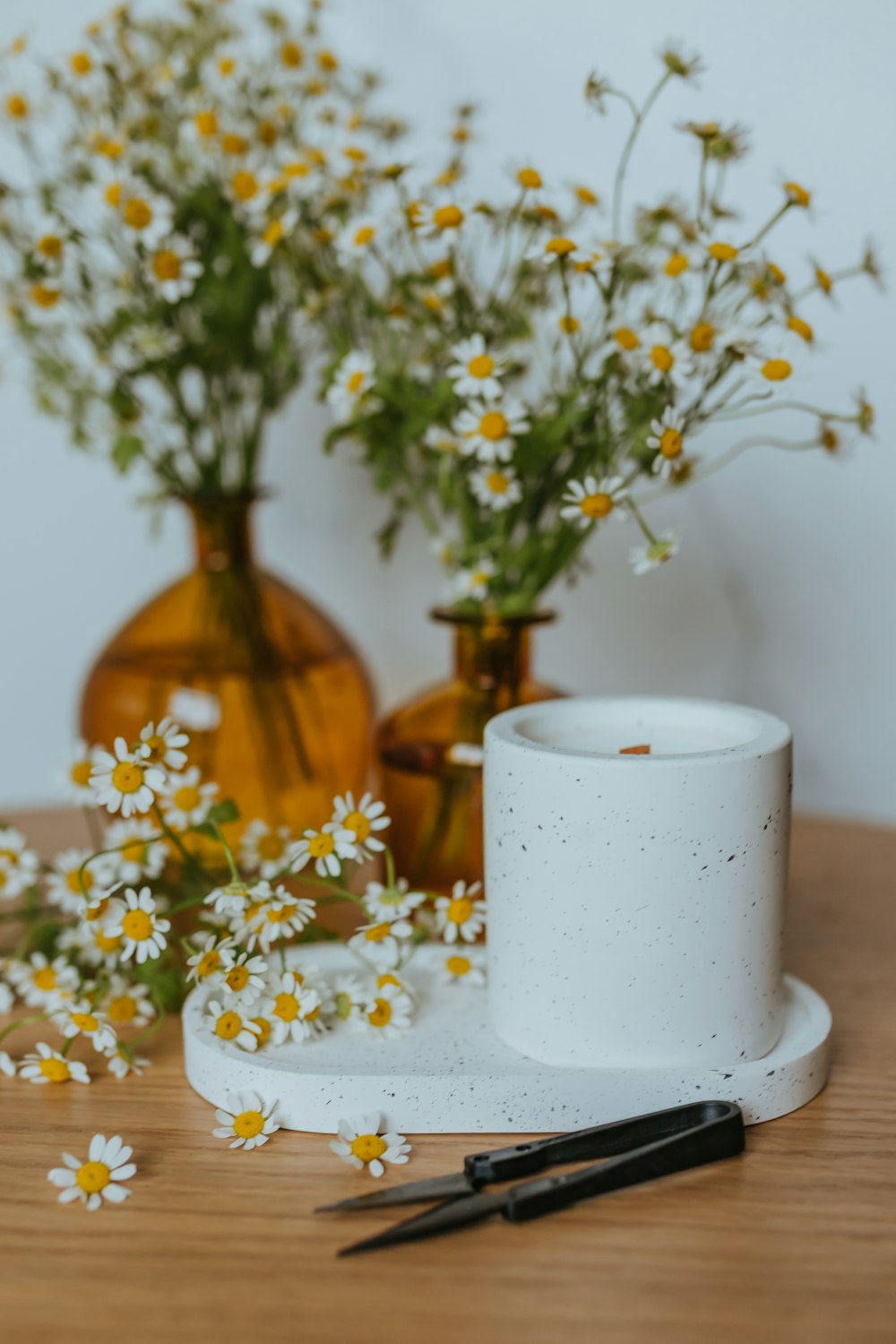 a couple of vases sitting on top of a wooden table