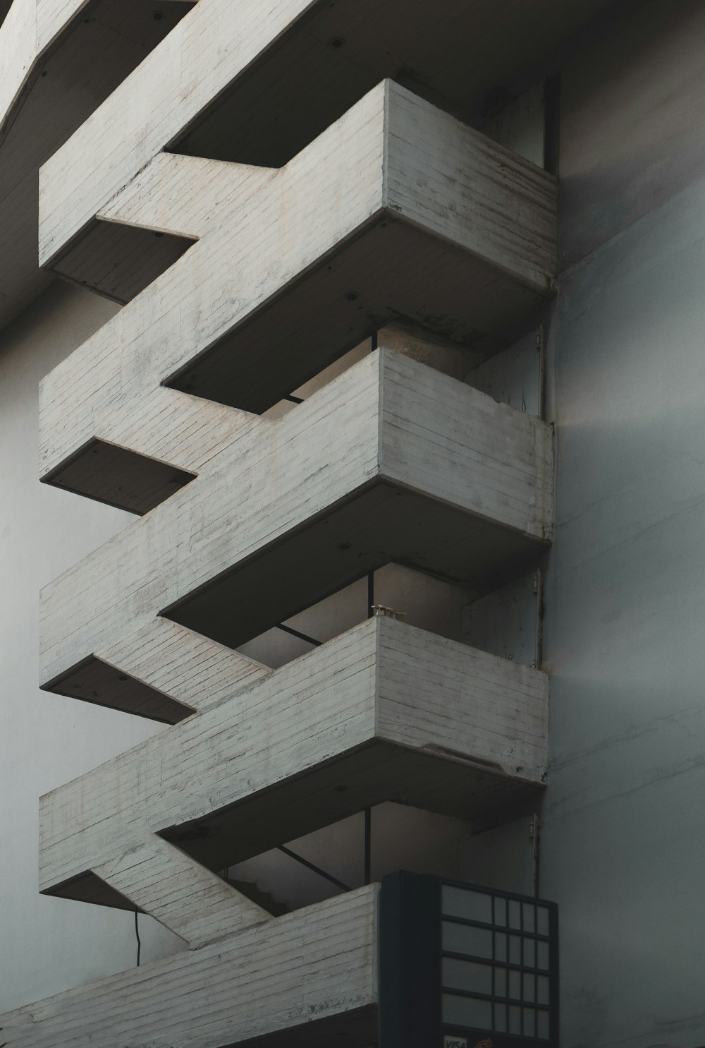 a tall building with multiple balconies on top of it