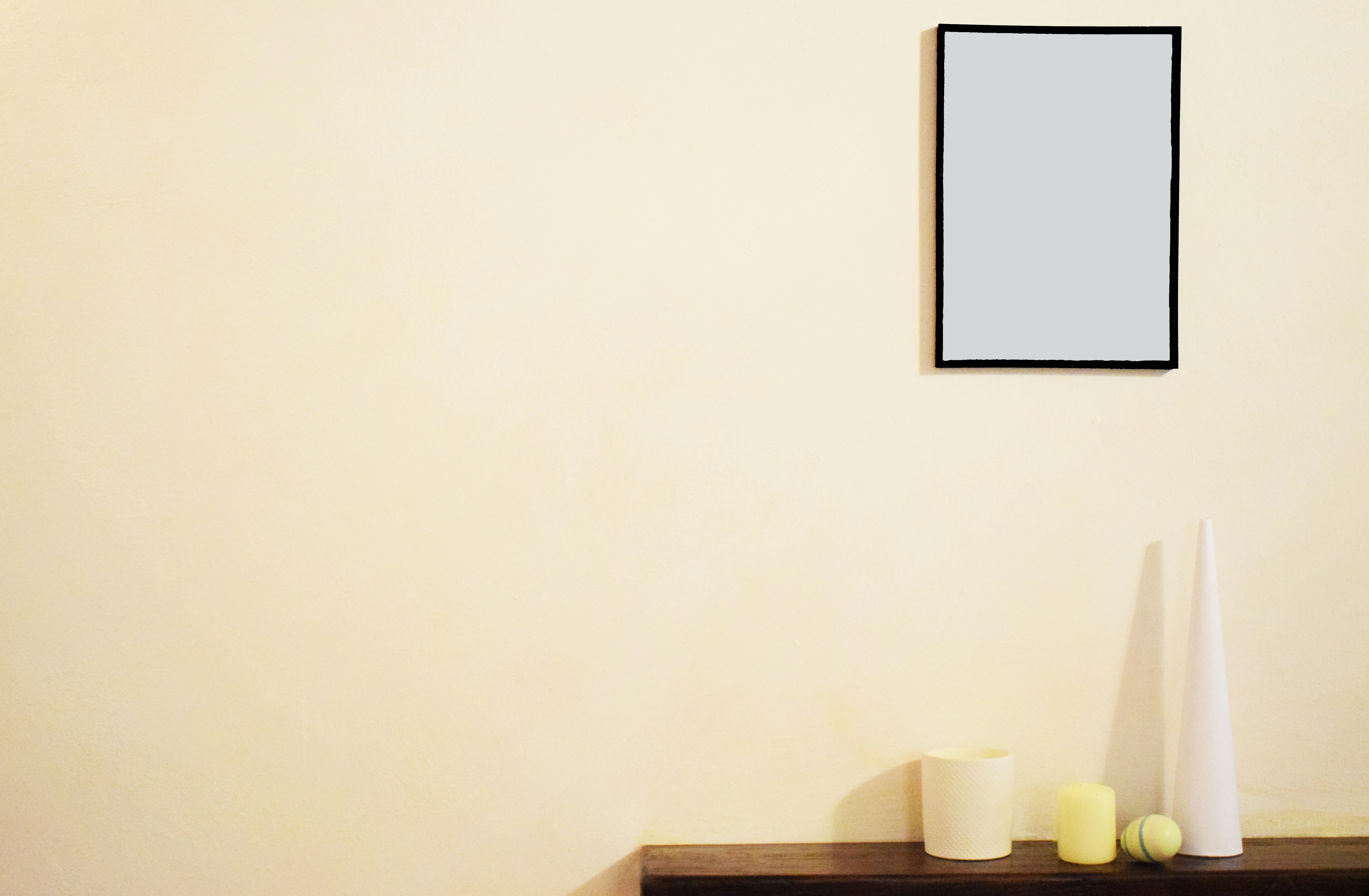 Conversational AI chatbot interface on a laptop screen next to a notepad and headphones, illuminated in a cozy office setting