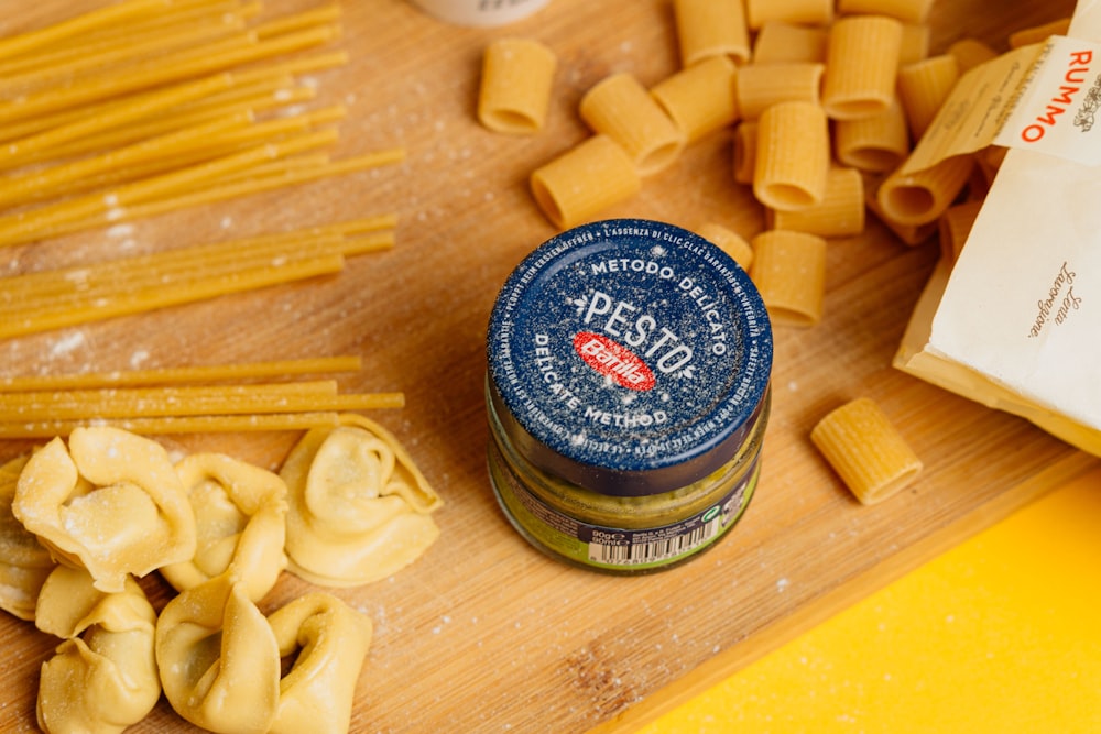 a wooden cutting board topped with lots of pasta