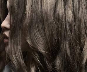 a close up of a person with long hair