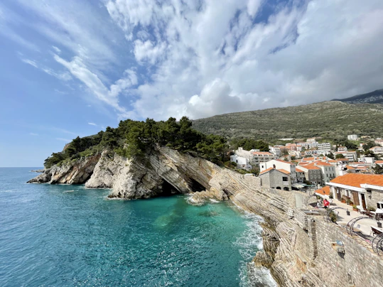 a beach with a small island in the middle of it
