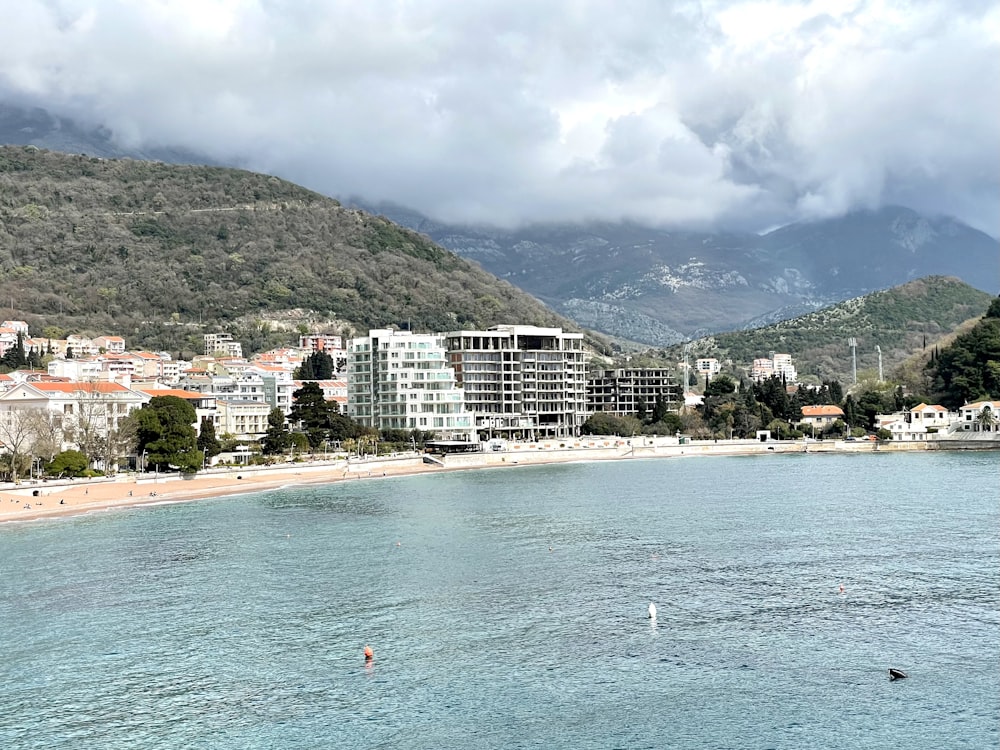 a view of a beach with a city in the background