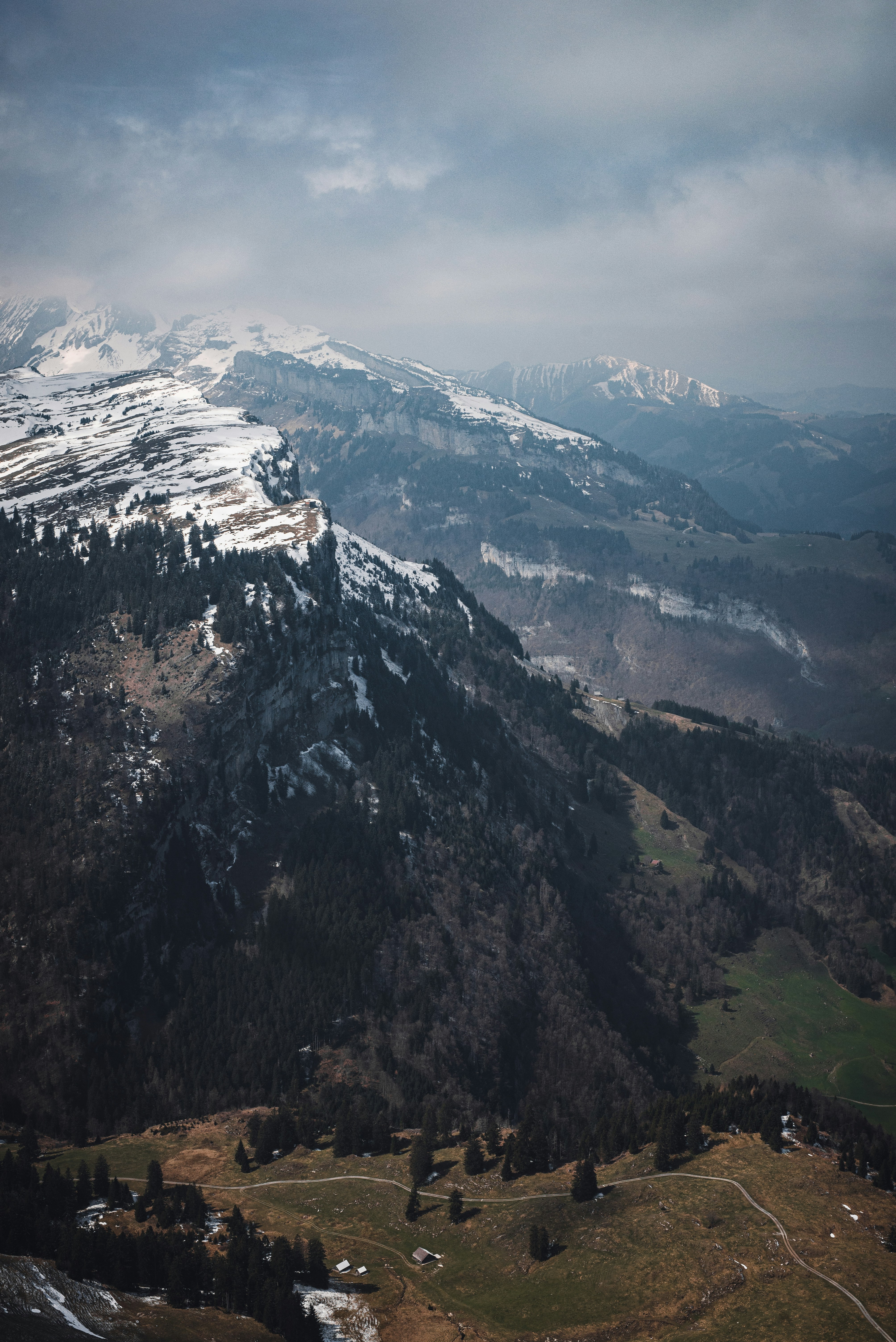 a view of a snowy mountain range from an airplane