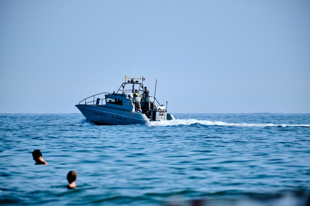 a small boat in the middle of the ocean