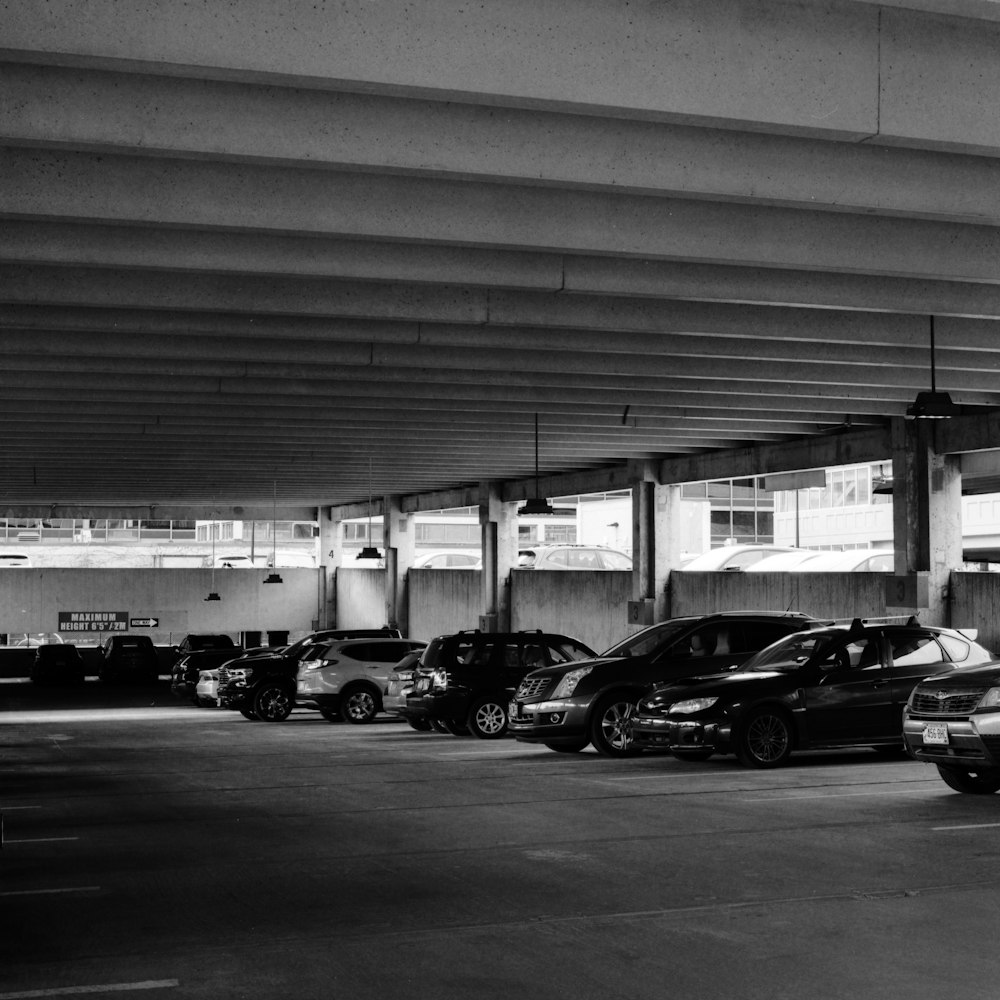 a parking garage filled with lots of parked cars