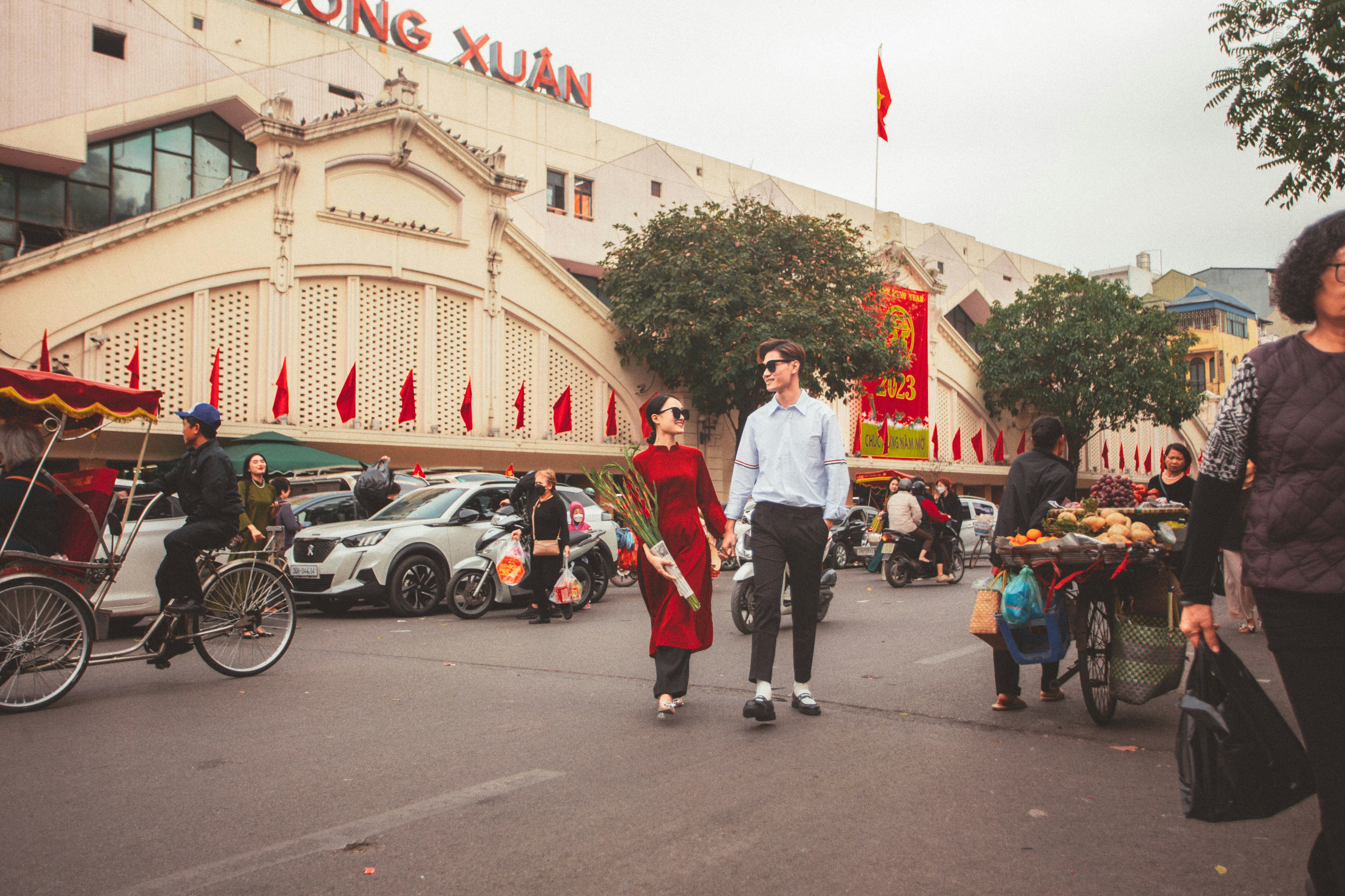 a man and a woman walking down a street