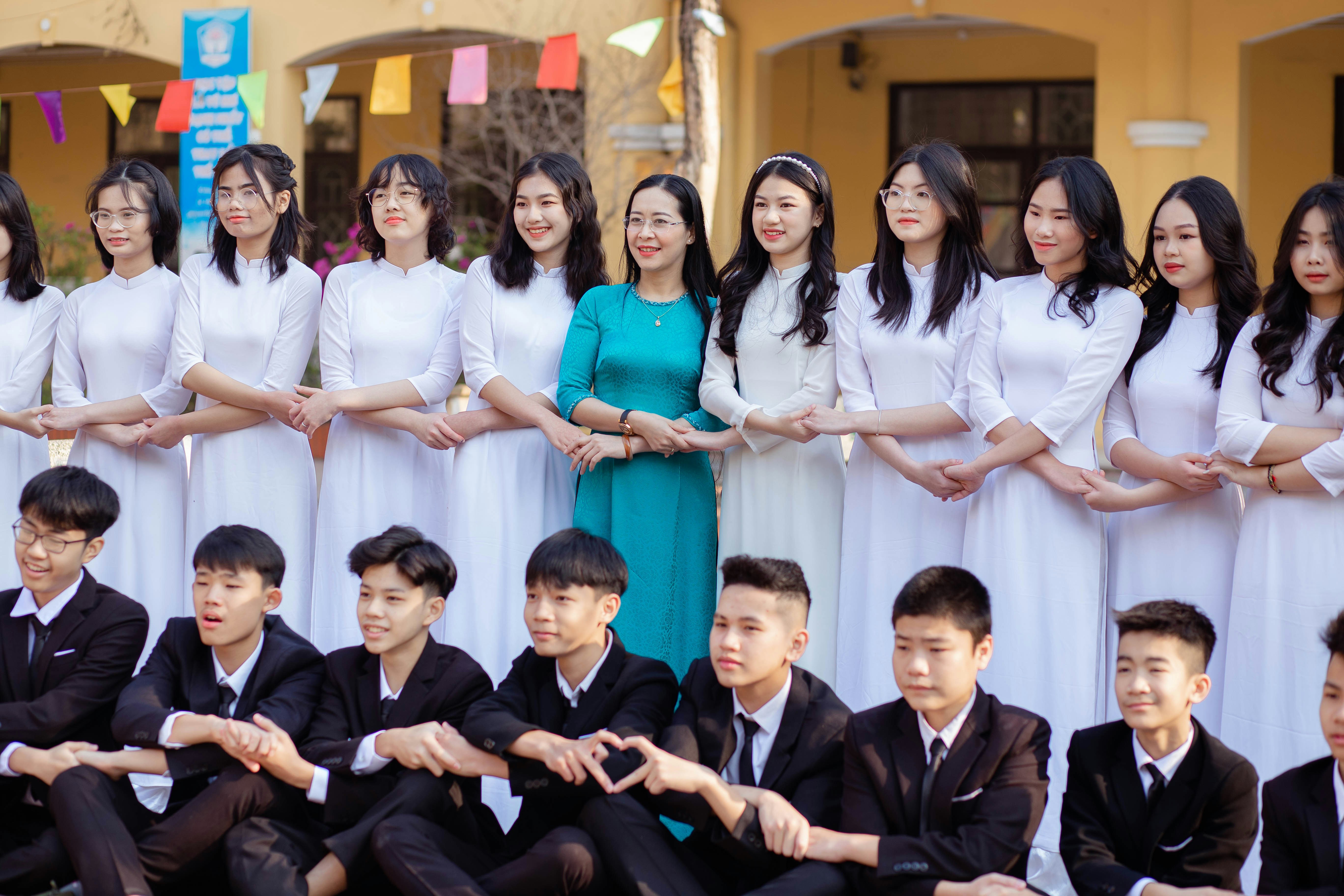 a group of young people standing next to each other