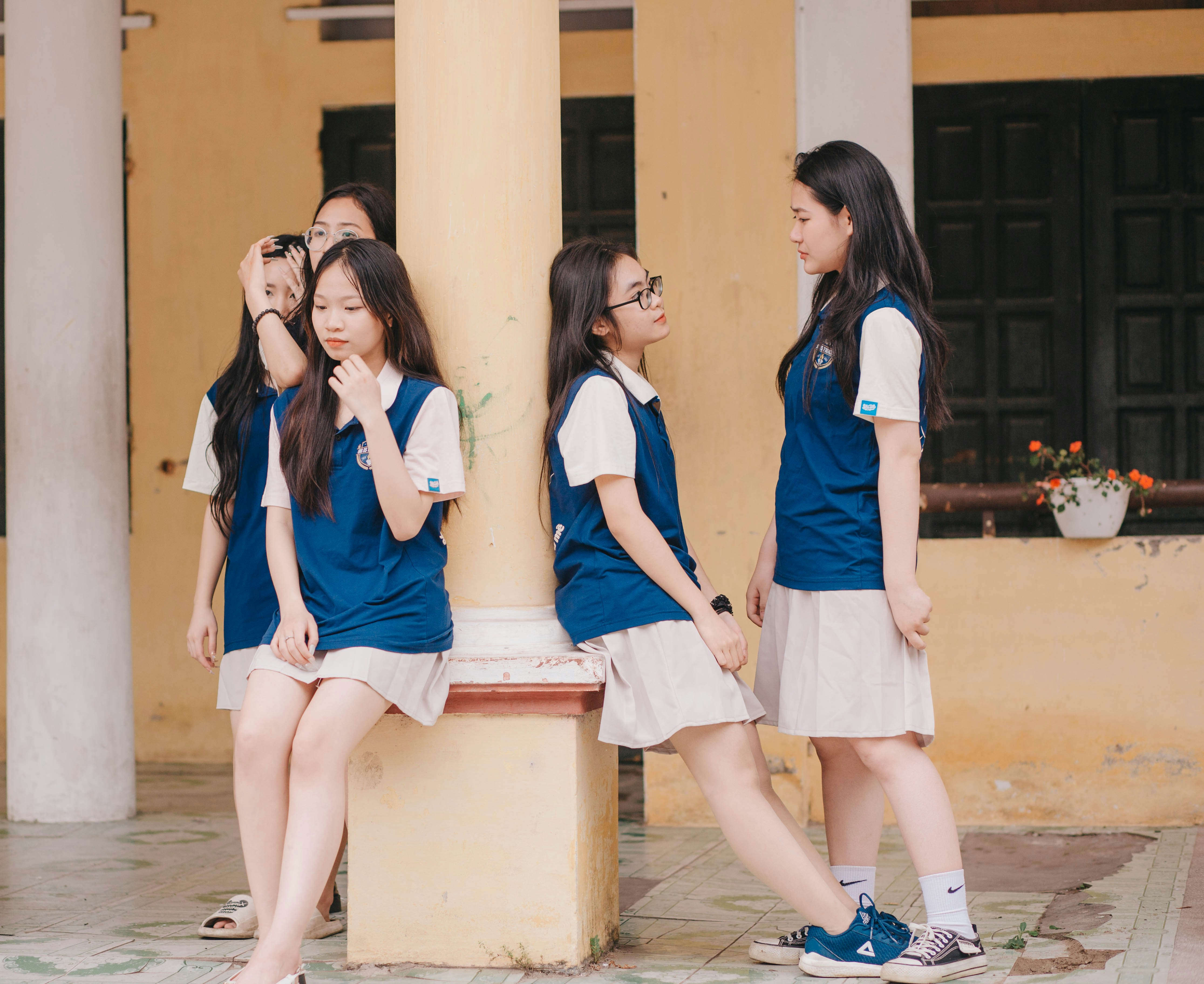 a group of young girls standing next to each other