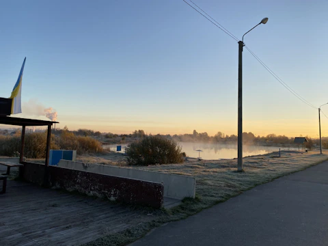 Sunrise run along a quiet lakeside trail symbolizing new beginnings.