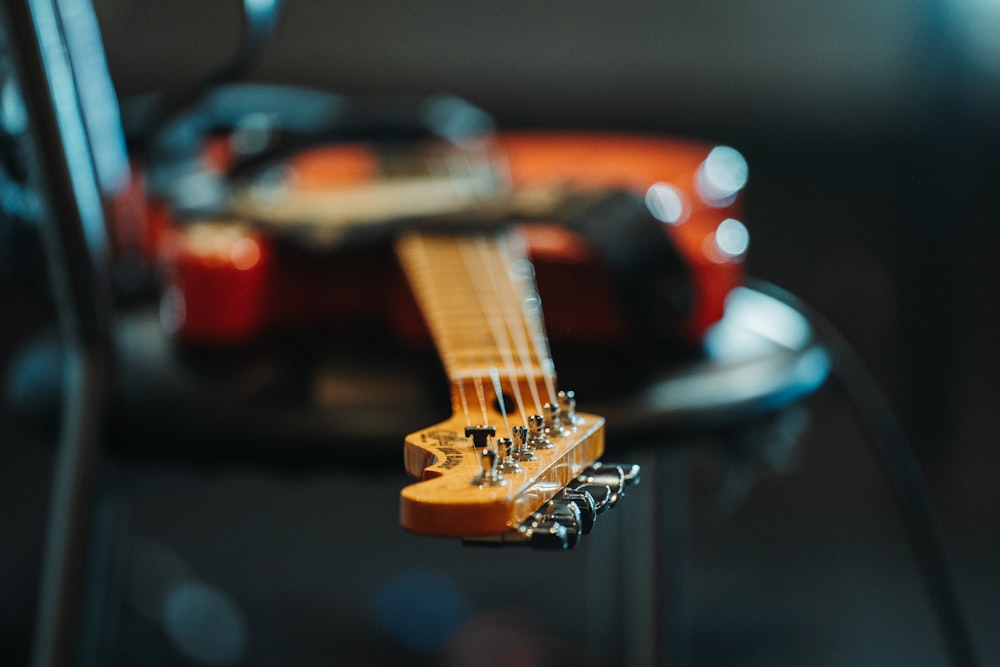 a close up of an electric guitar on a table