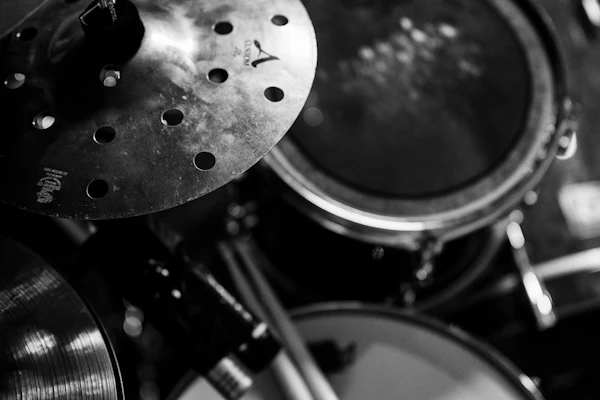 Close-up of a drummer playing a full drum kit