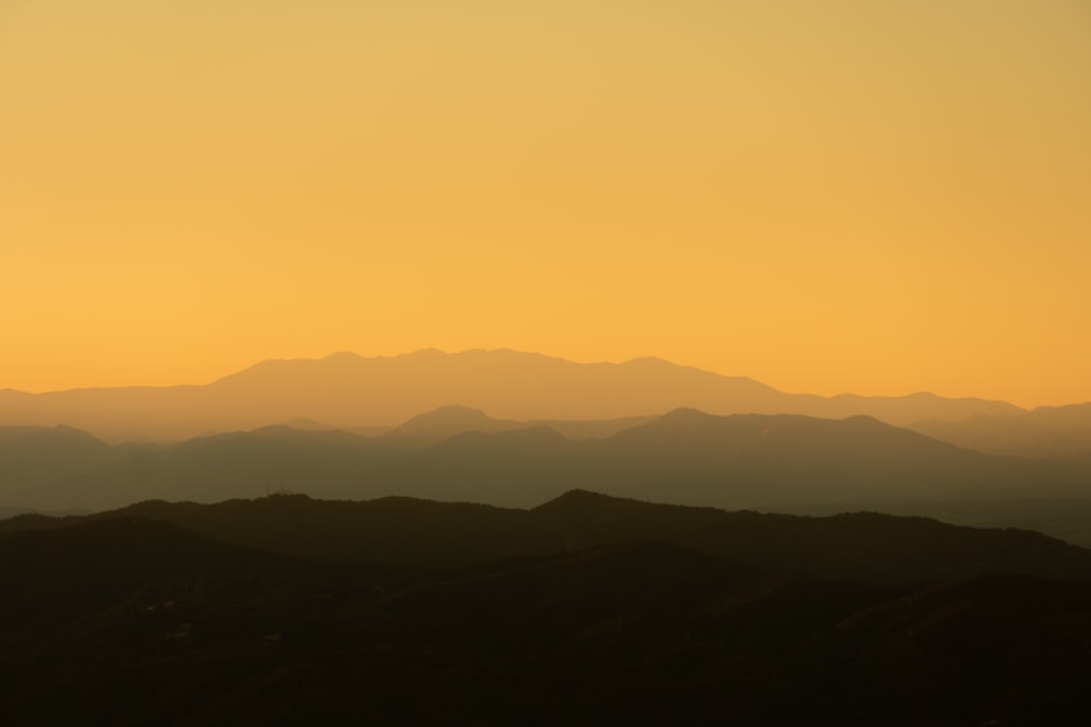 a view of a mountain range at sunset