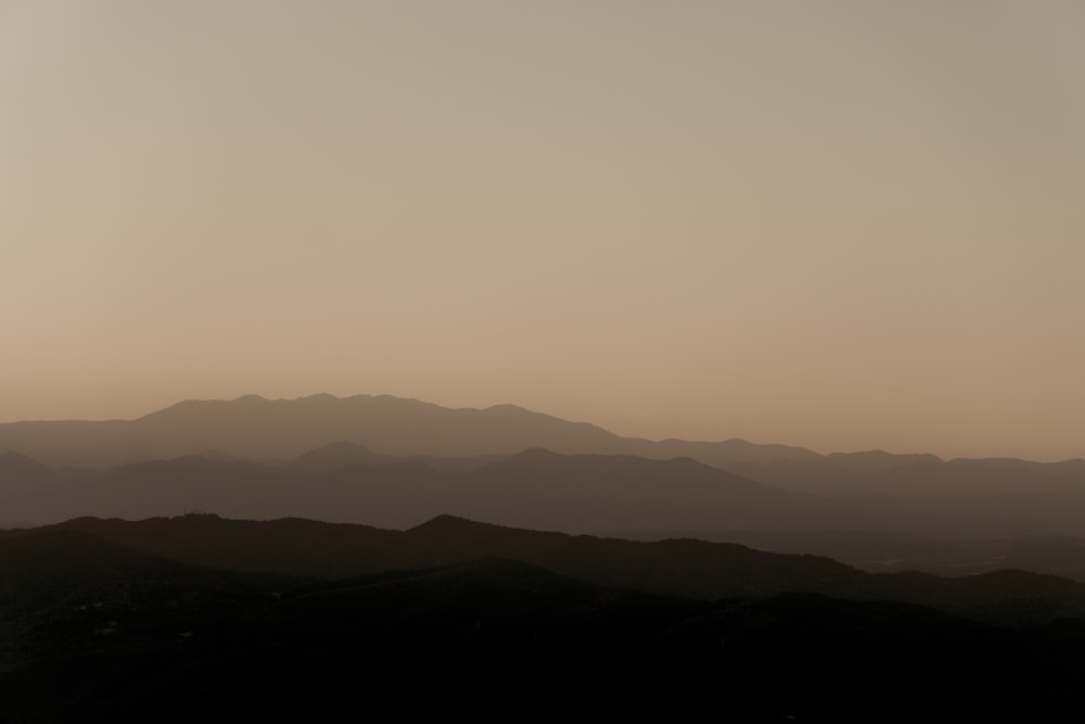 a view of a mountain range at sunset