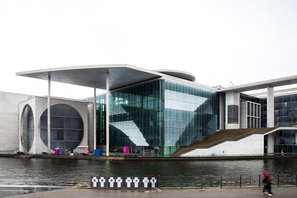 a large building next to a body of water