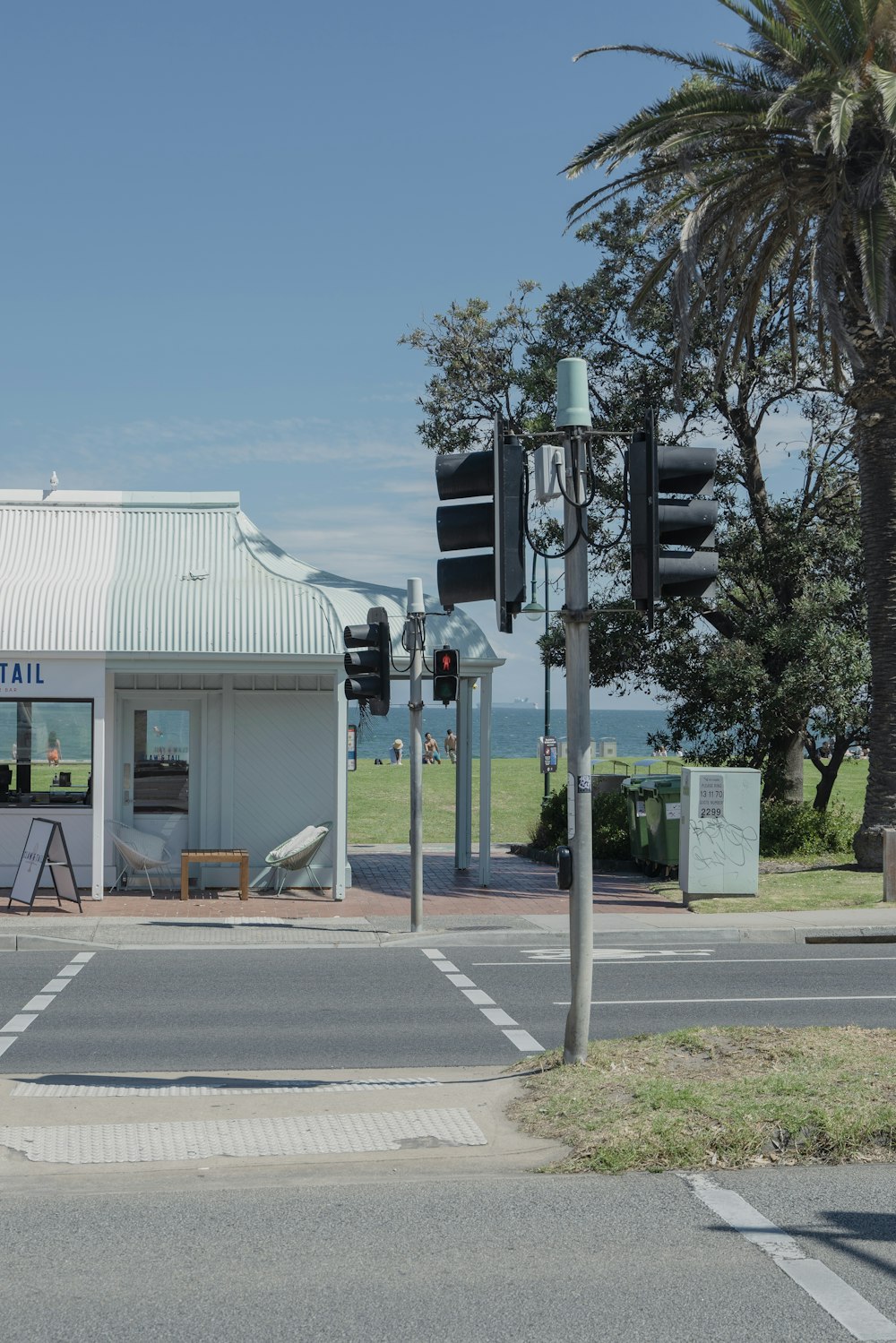 a street corner with traffic lights and a building