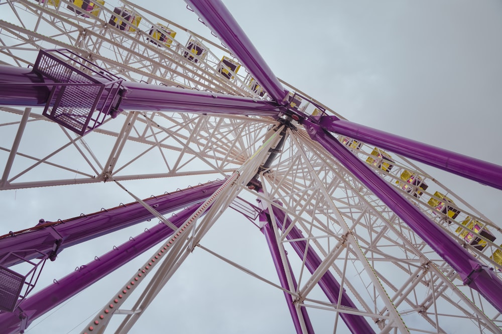 a close up of a ferris wheel on a cloudy day