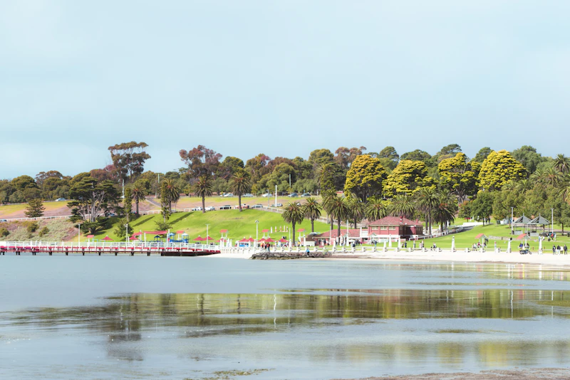 Waterfront with trees and a bridge in Geelong, Victoria