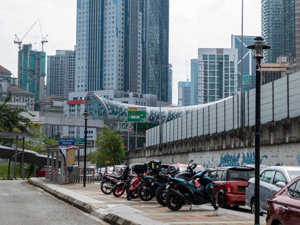 a bunch of motorcycles parked on the side of the road