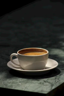 a cup of coffee sitting on top of a saucer