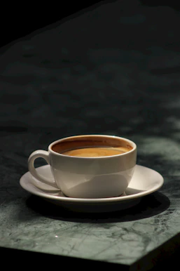 a cup of coffee sitting on top of a saucer