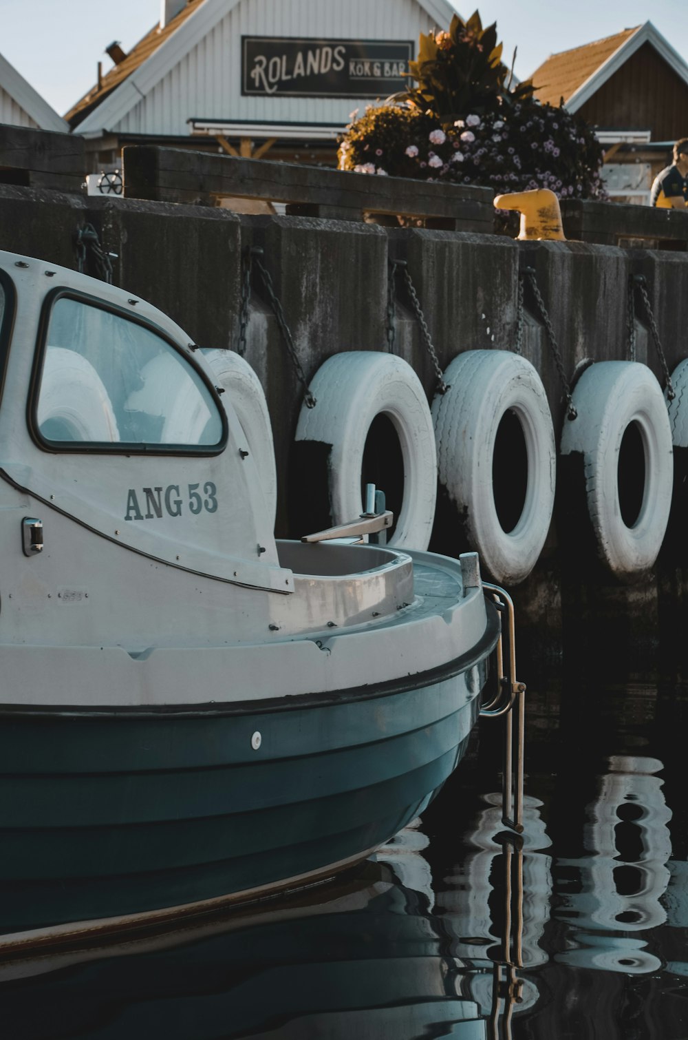 a row of white boats sitting next to each other