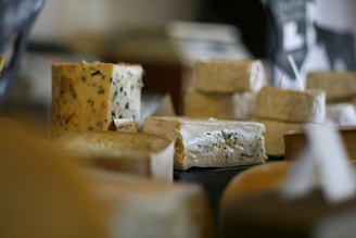 several different types of cheese stacked on top of each other