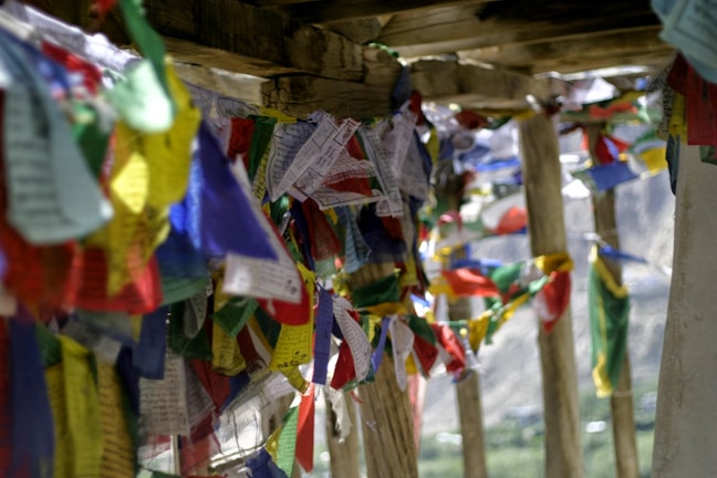 A vibrant display of handcrafted prayer flags fluttering in the wind.
