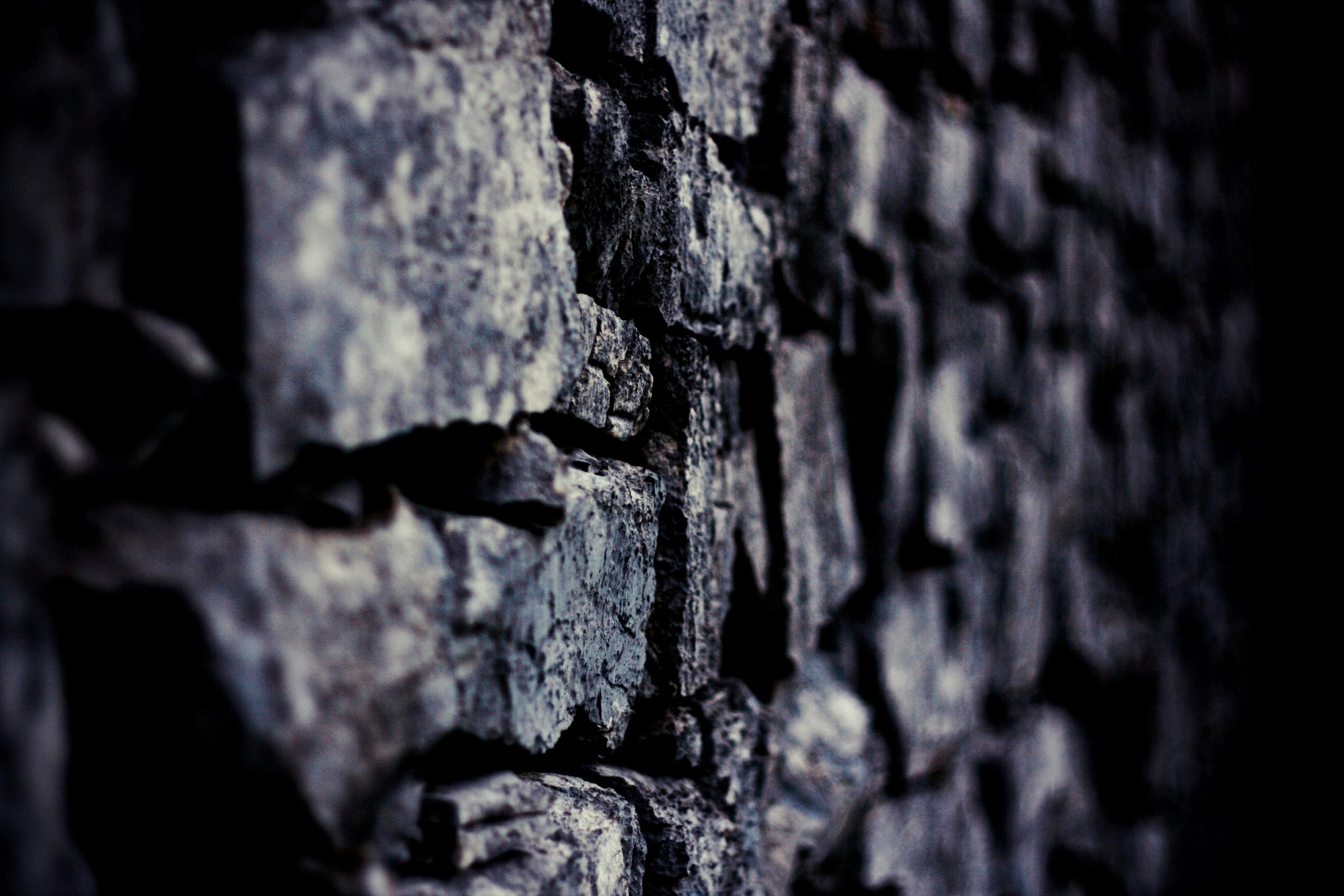 a close up of a wall made of rocks