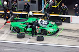 Exciting live pit stop action showcasing teamwork and cutting-edge technology