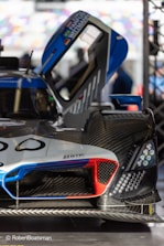 A detailed CFD simulation showing airflow over a racing car in vibrant colors.