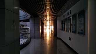 A bright hallway decorated with inspiring educational posters and student artwork.