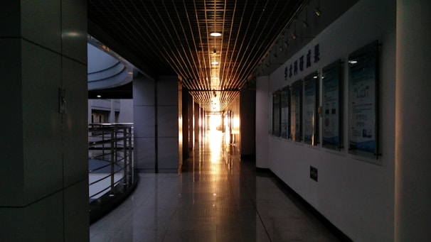 A bright hallway decorated with inspiring educational posters and student artwork.