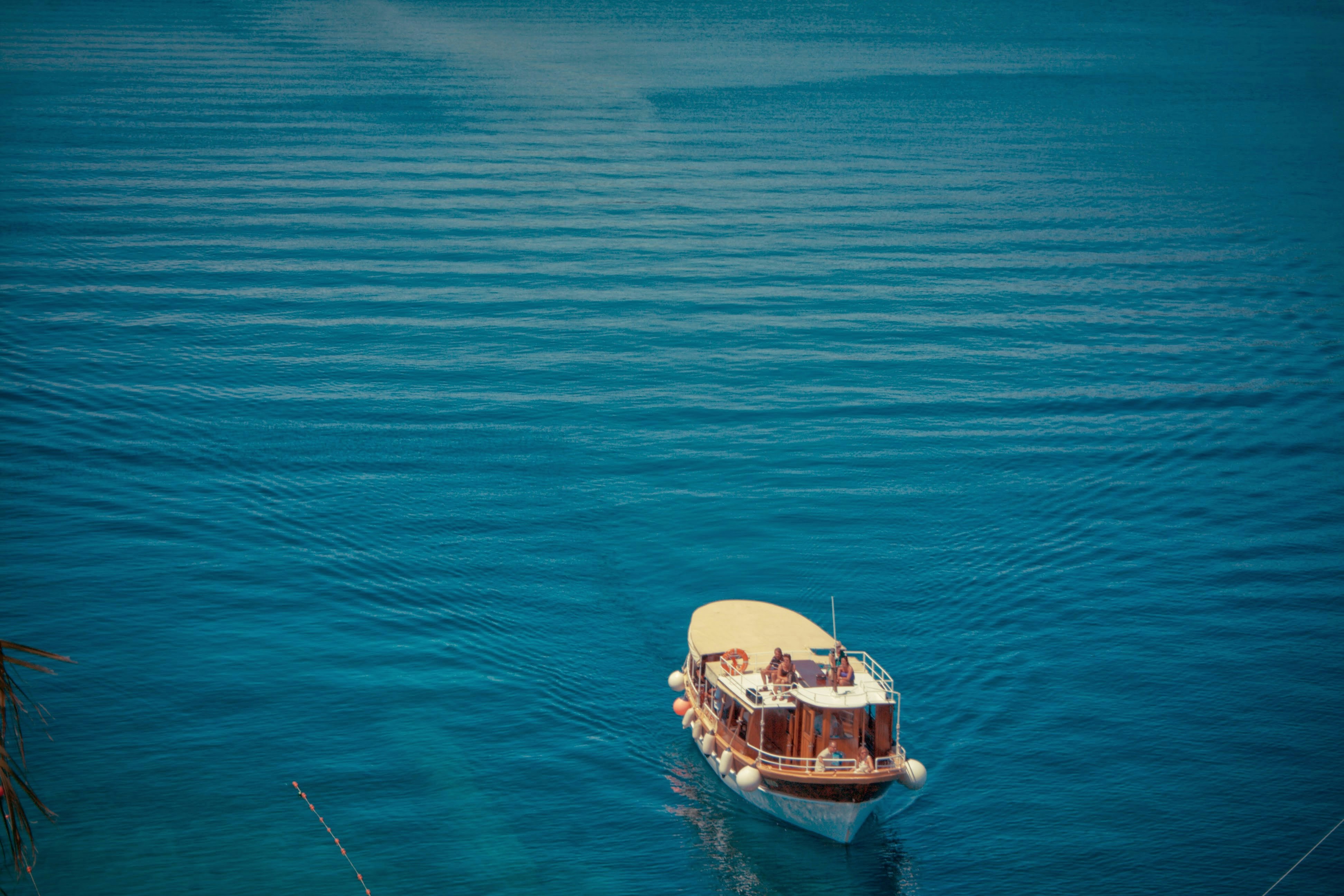 a boat floating on top of a large body of water