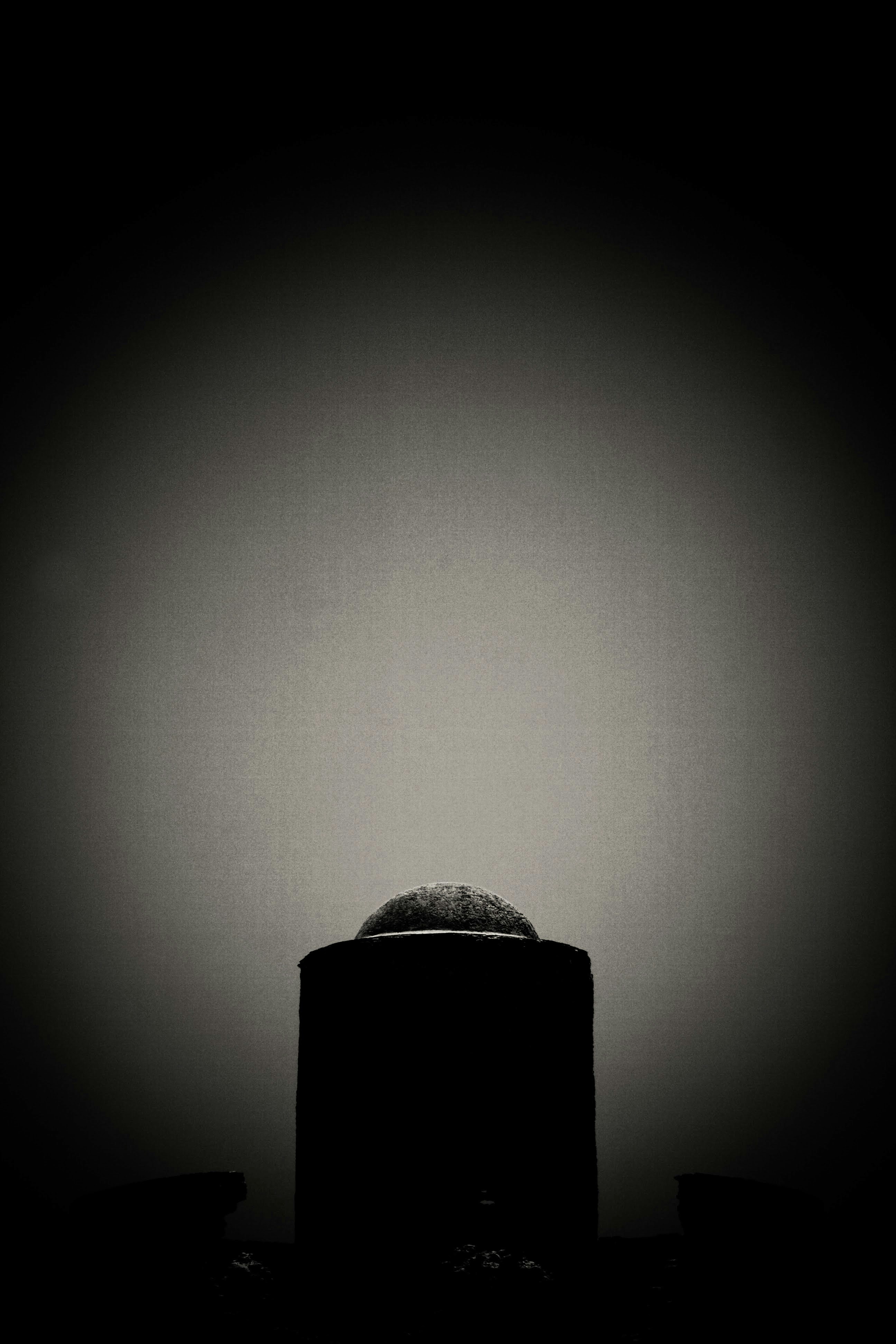 a black and white photo of a round object