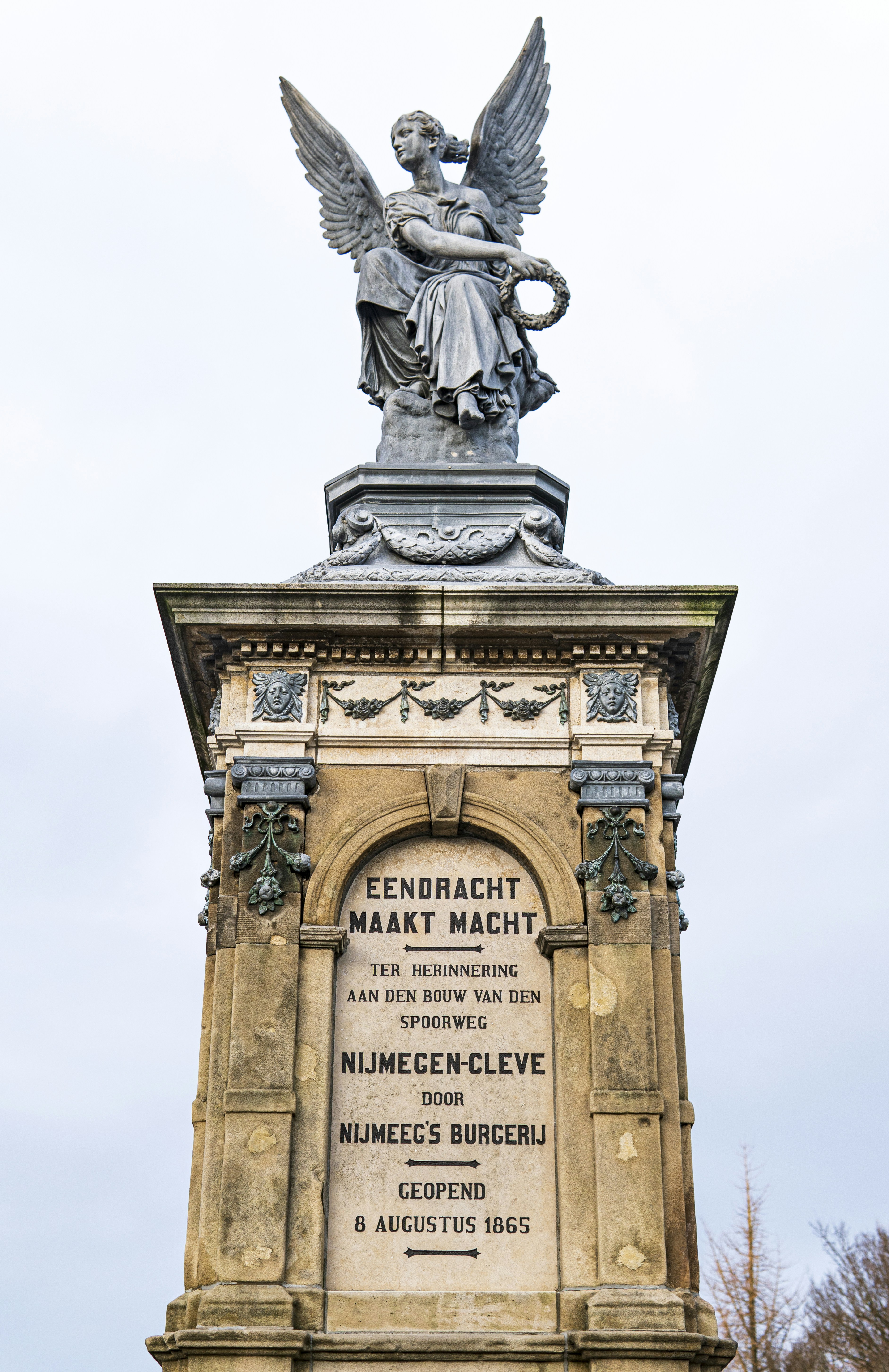 a statue of an angel on top of a building photo Free Nijmegen Image