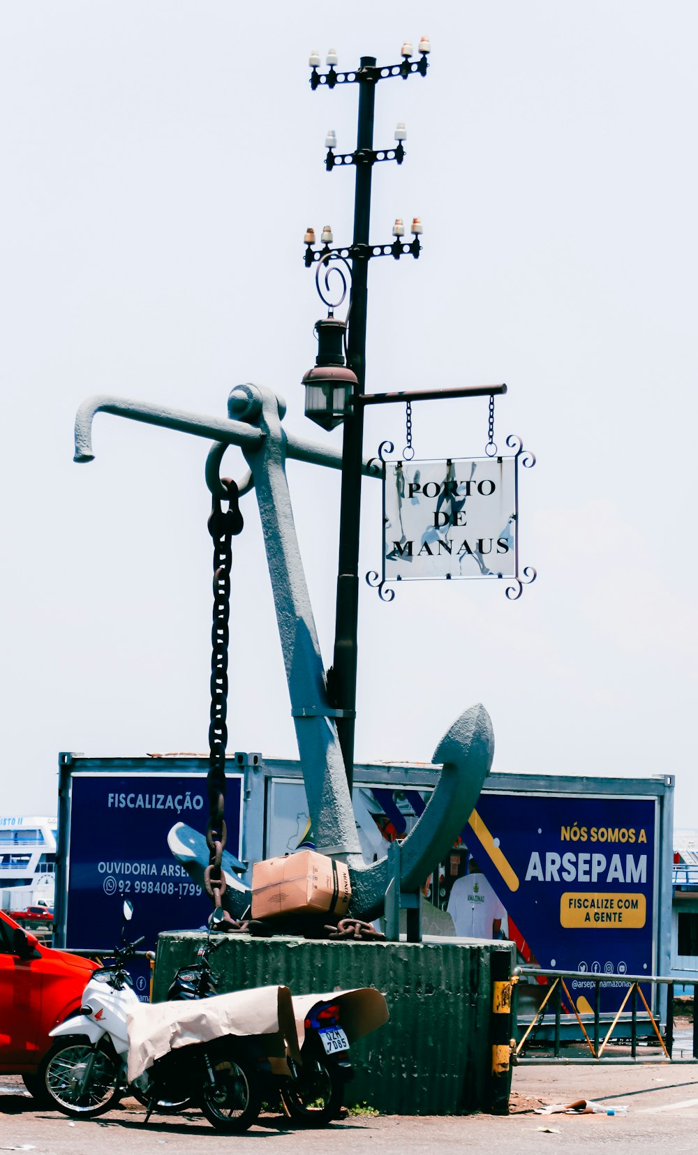 a scooter is parked next to a street light