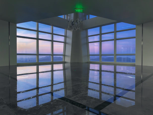 Sky gym with floor-to-ceiling windows overlooking George Town skyline