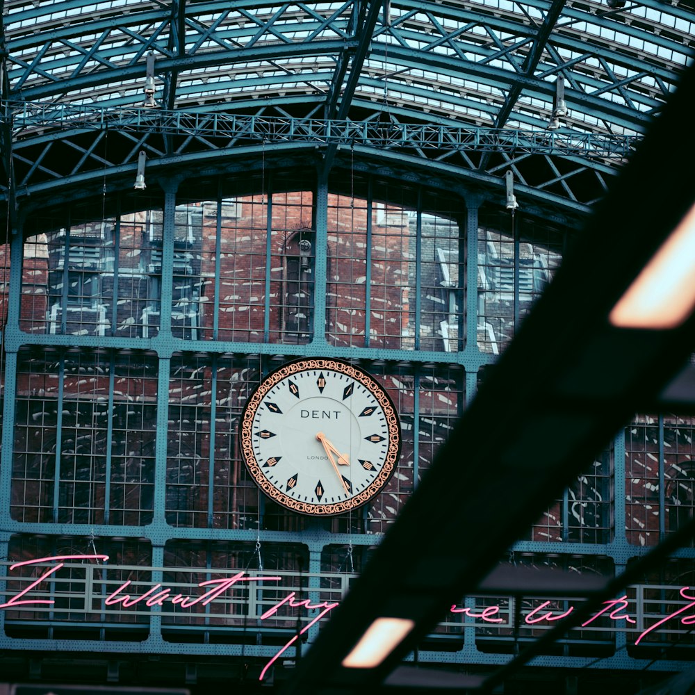 a large clock mounted to the side of a building